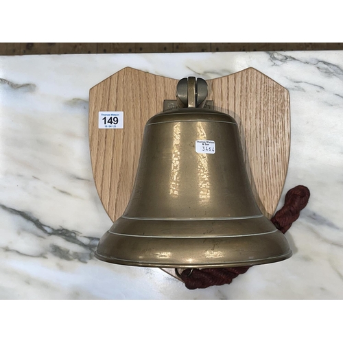 149 - Brass ships bell on shield mount.