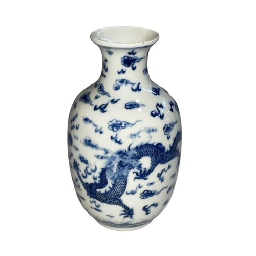 159 - Chinese blue and white vase decorated with dragons and clouds, six character mark to base, 16cm.