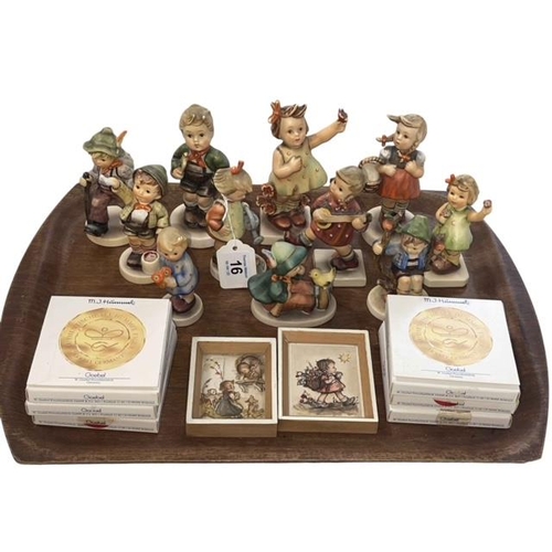 16 - Eleven Hummel figures, six small dishes and two prints.