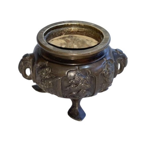 160 - Oriental bronze censor with twin elephant mask handles decorated with bird and floral panels, 7cm hi... 