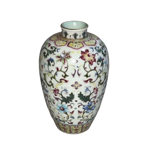 163 - Chinese Famille Rose decorated vase with Qianlong mark to base, 15cm.