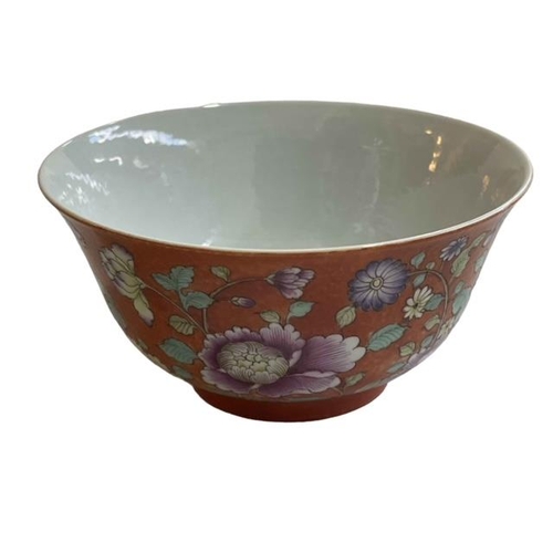 173 - Chinese bowl with floral and famille rose design on orange ground, iron red stamp to base, 13cm.