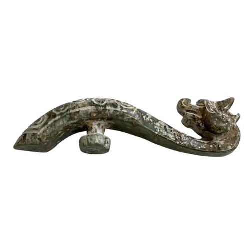 174 - Chinese green jade belt hook in the shape of a dragon, 10cm length.