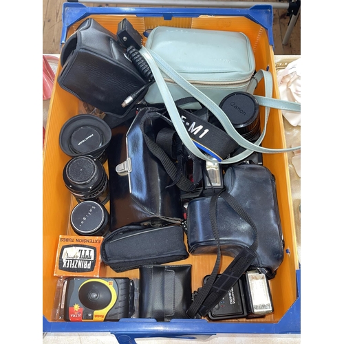 25 - Box of vintage cameras, Minolta Mini 35 projector, Hasselblad SCA 390 flash adaptor, lenses, etc.