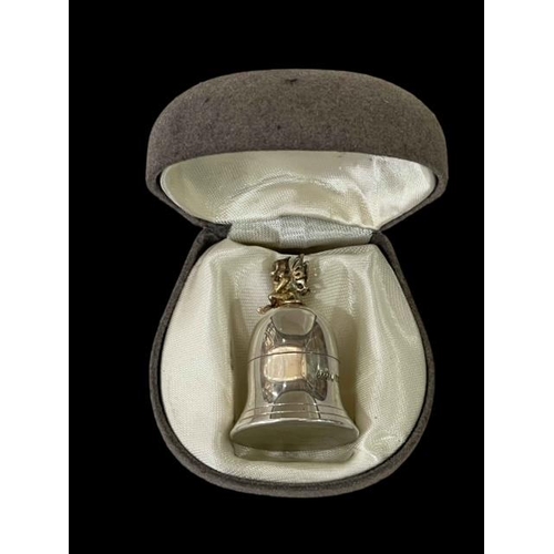 262 - Silver bell shaped 'first tooth' holder with gilt fairy finial, 4cm.