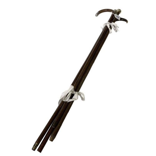 274 - Four silver mounted walking sticks.