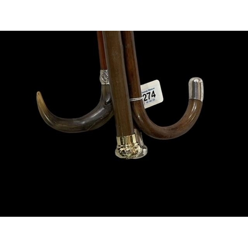 274 - Four silver mounted walking sticks.