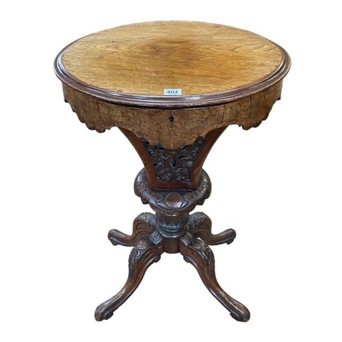 404 - Victorian mahogany and inlaid walnut oval work table, 74cm by 50cm by 40cm.