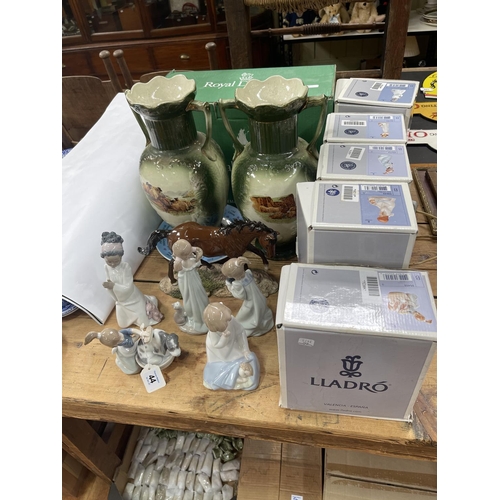 44 - Five boxed Lladro figurines, Royal Doulton boxed horse and a pair of vases.