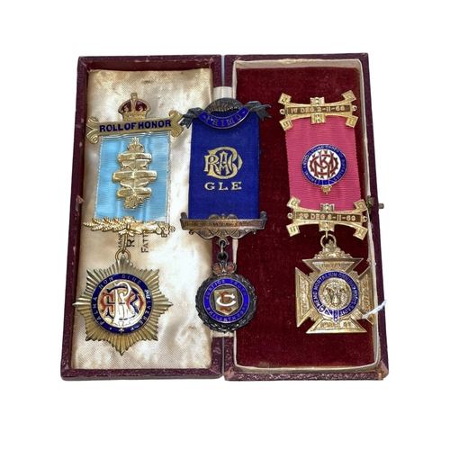 215 - Two silver and one gilt Masonic medals.