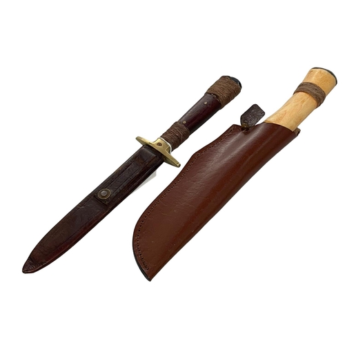 217 - Knife in leather scabbard, overall 33cm, and Morakniv knife (2).