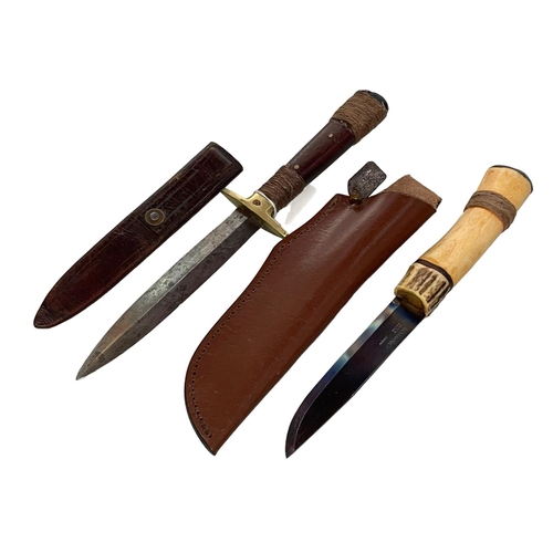 217 - Knife in leather scabbard, overall 33cm, and Morakniv knife (2).