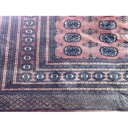 296 - Rose pink ground Pakistani Bokhara carpet 2.75 by 3.40.