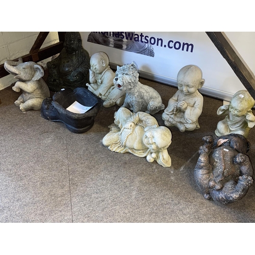 314 - Collection of nine garden ornaments including Buddha's, dogs, boot planter, etc.