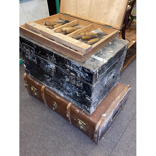 315 - Two vintage trunks, collection of wood working chisels and spirit level.