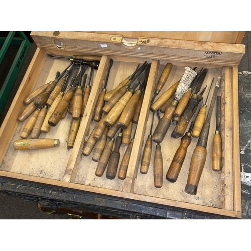 315 - Two vintage trunks, collection of wood working chisels and spirit level.