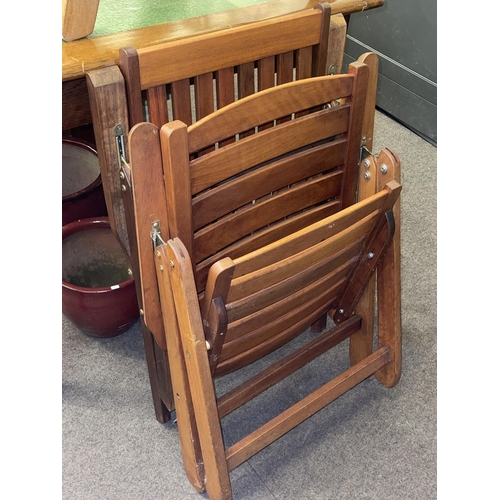 319 - Four adjustable teak folding garden chairs (3x1).