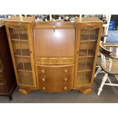 351 - Oak bureau centre cabinet.