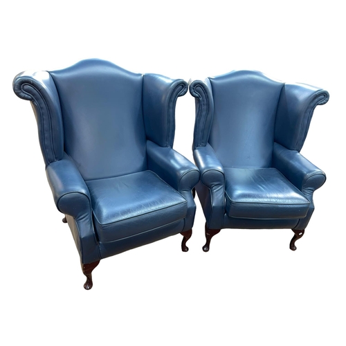 372 - Pair blue leather wing back armchairs.