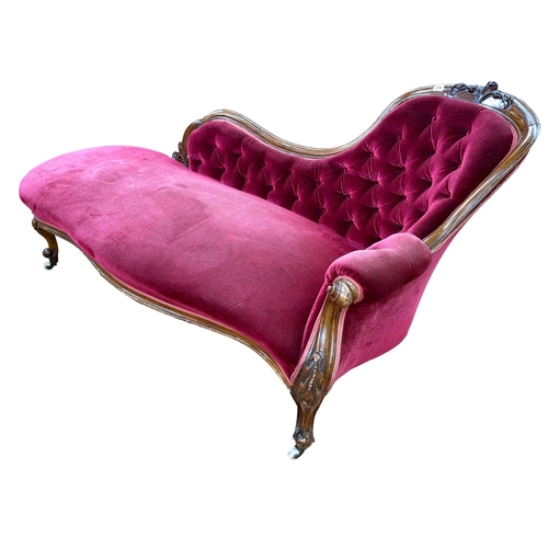 378 - Victorian walnut framed chaise longue with serpentine front seat in wine buttoned draylon.