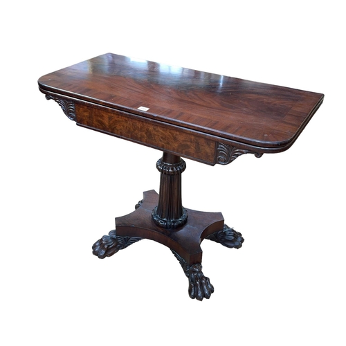 393 - Regency mahogany fold top tea table on turned carved pedestal to quadriform paw feet base, 74cm by 9... 