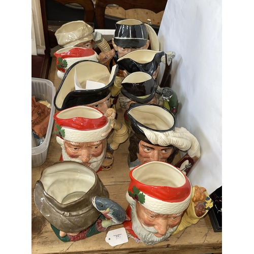 50 - Ten Royal Doulton toby jugs including Santa Claus, The Poacher, The Walrus and Carpenter, etc.