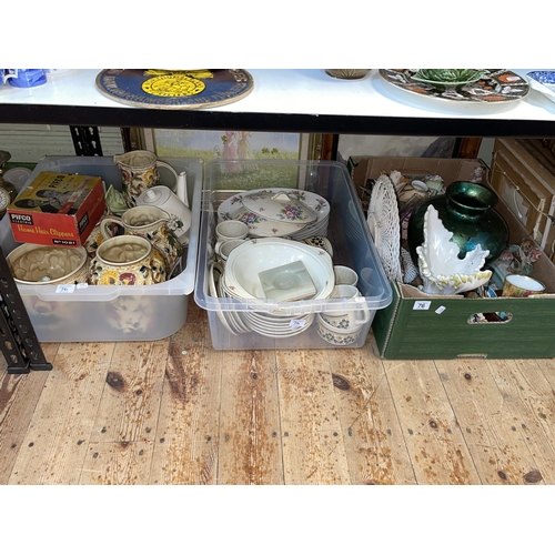 76 - Nine boxes of decorative pottery, vases, figurines, paintings, magazines, lamps etc.