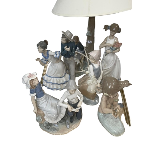 8 - Six Nao figure and groups including table lamp.