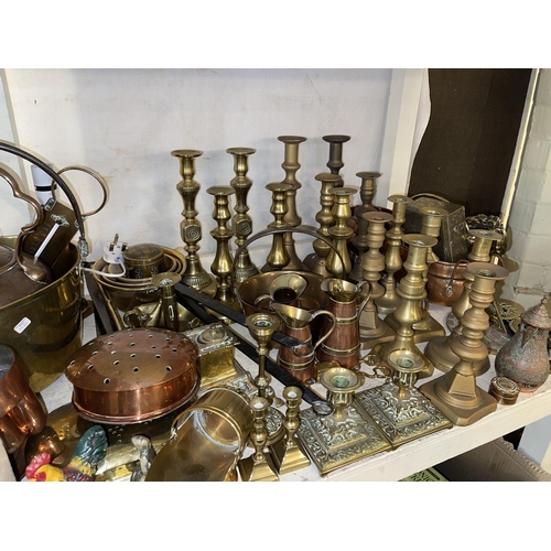 96 - Collection of brass and copper wares including candle holders, scales with weights, jam pan, kettles... 