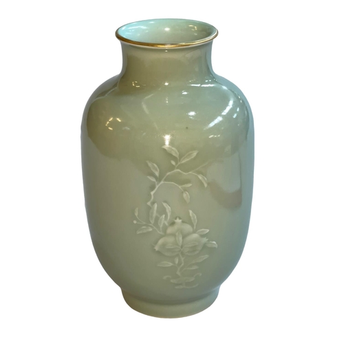 151 - Chinese Celadon vase with raised floral pattern, Qianlong mark to base, 23cm.