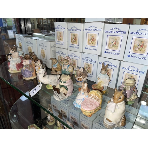 24 - Collection of fourteen Royal Albert Beatrix Potter figures including The Christmas Stocking, Pig Rob... 