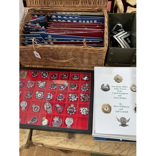 45 - Collection of Police and Military cap badges, buttons, books, etc.