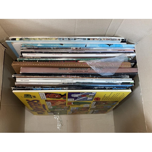 79 - Four boxes of LP and single records.