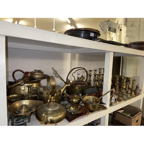 96 - Collection of brass and copper wares including candle holders, scales with weights, jam pan, kettles... 