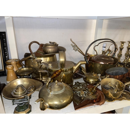 96 - Collection of brass and copper wares including candle holders, scales with weights, jam pan, kettles... 