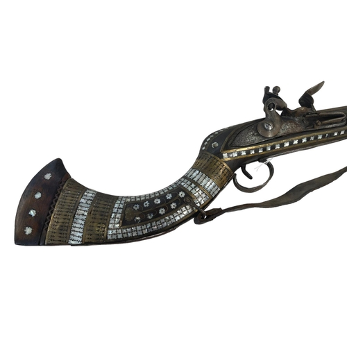 104 - Replica inlaid mother of pearl flintlock rifle.