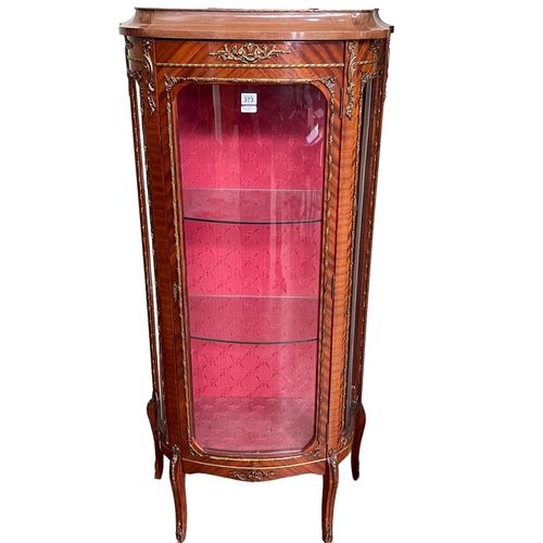 373 - Continental brass mounted bow front vitrine, 142cm by 65cm by 33cm.