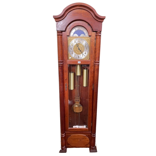 378 - Emperor Clock Company triple weight longcase clock with moon phase dial, 195cm.