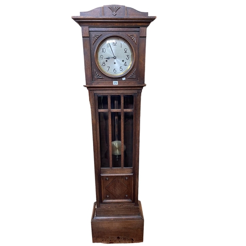 379 - 1920s/30s oak longcase clock, 183cm.