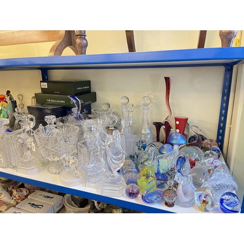 75 - Good collection of clear and coloured glass including glass decanters, glass clowns, paperweights, e... 