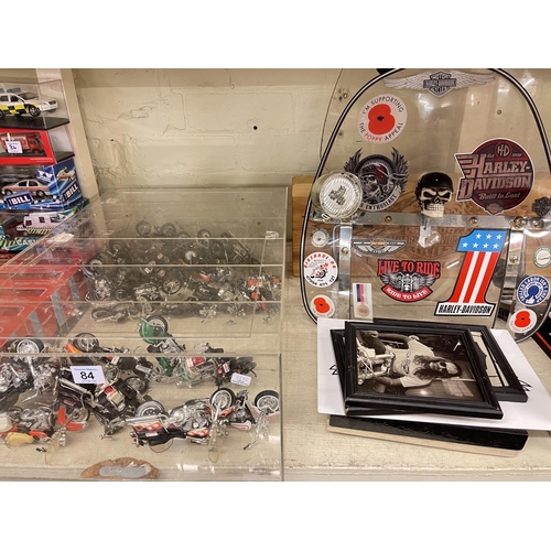 84 - Collection of Harley Davidson memorabilia, model motorcycles, trucks and emergency vehicles, etc.