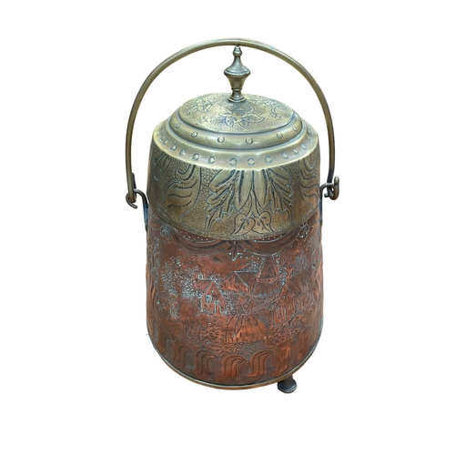 102 - Copper and brass lidded pot with embossed decoration on three feet with swing handle.