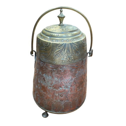 102 - Copper and brass lidded pot with embossed decoration on three feet with swing handle.