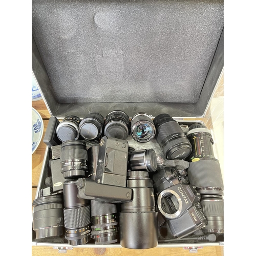 113 - Contax 167mt camera and collection of lenses including Canon and Nikon in aluminium flight case.