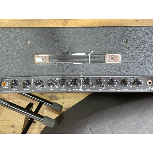 116 - Traynor 40 watt amplifier with spare valves, cables, foot pedal and folding stand.