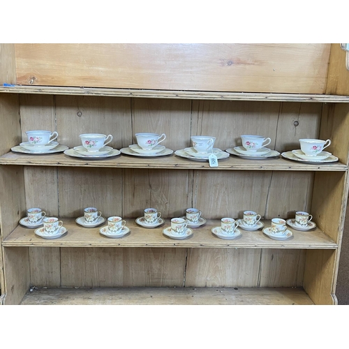 120 - Eleven Noritake 'Aubery' coffee cans and saucers, and six Royal Albert rose decorated trios.