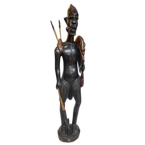 122 - Large carved wood Ethnic figure of a hunter, 102cm.