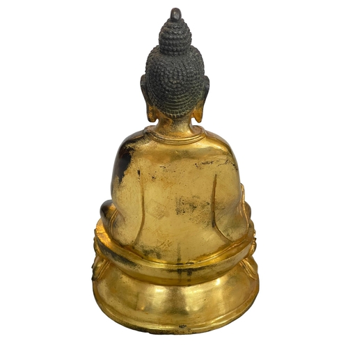 127 - Chinese gilt bronze model of a Buddha, 28cm.