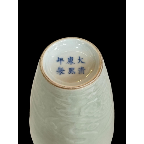 129 - Chinese Celadon vase decorated with raised dragons on wood stand, six character mark to base, 24.5cm... 