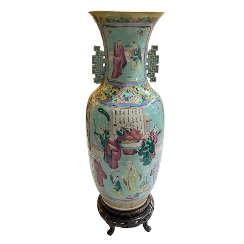 132 - Large Chinese Famille Rose two handled vase decorate with figures on carved wood stand, total height... 